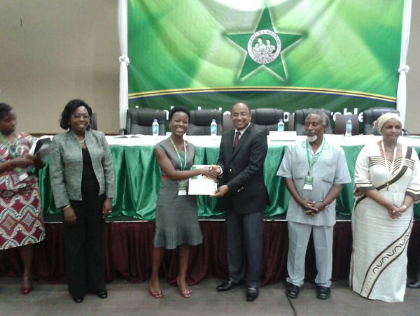 Dr. Kahabuka receiving a young scientist